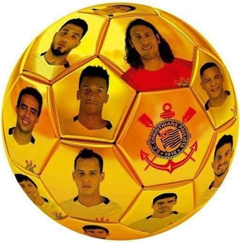 A Yellow Soccer Ball With Many Different Faces On It