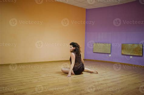 Curly Brunette Plus Size Model Doing Acrobatic At Dance Room 8677769
