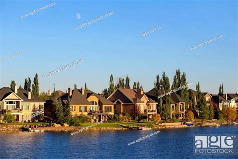 Houses along a lake; Calgary, Alberta, Canada, Stock Photo, Picture And ...