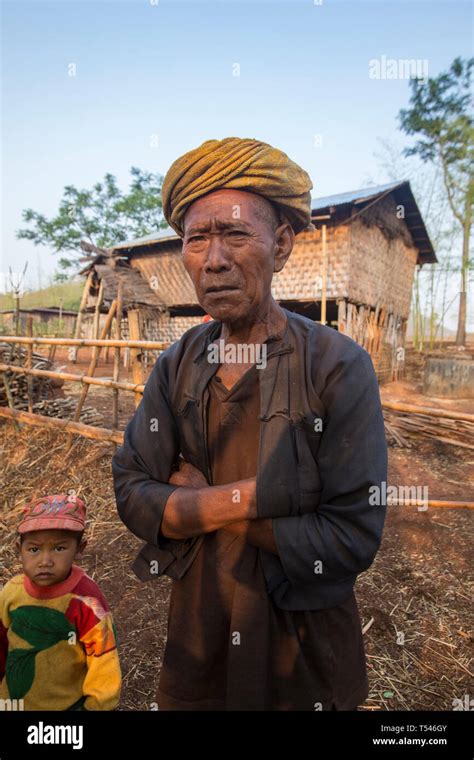 Elderly Shan Man With His Grandson In A Hill Village On The Trek From