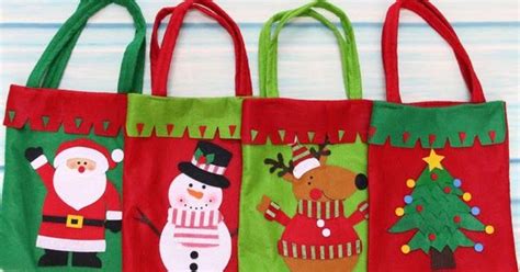 Three Christmas Bags With Santa And Snowmen On Them