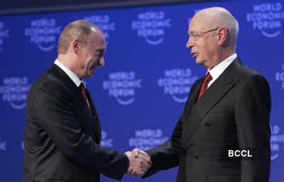 Russian Prime Minister Vladimir Putin Left Shakes Hands With Wef