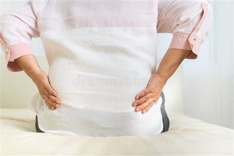 Back Pain Of Old Woman At Home Healthcare Problem Of Senior Concept