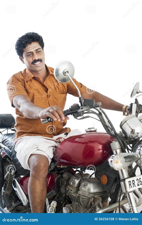 South Indian Man Riding A Motorcycle Royalty Free Stock Image