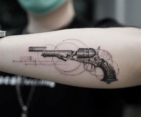 Black And Grey Revolver Tattoo On Forearm