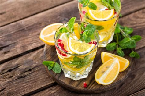 Lemon Mojito Cocktail With Mint And Pomegranate Cold Refreshing Drink