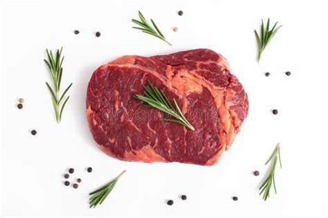 Raw Rib Eye Steak Of Beef With Rosemary Isolated On White Background