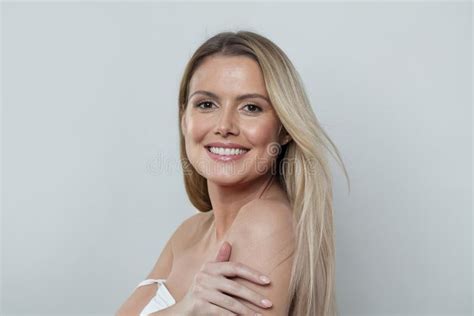 Closeup Studio Photo Of A Blonde Woman Fashion Model Smiling And Posing On White Stock Image