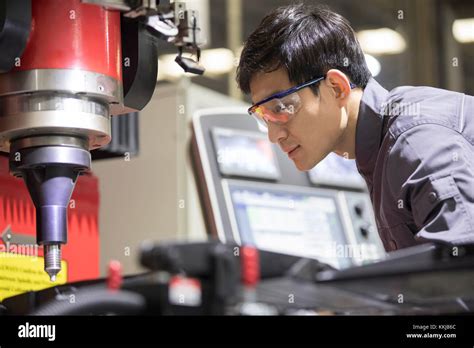 Confident Chinese Engineer Working In The Factory Stock Photo Alamy