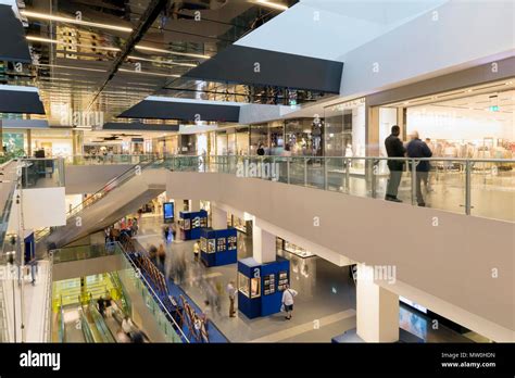 Shops inside a shopping center, on different floors. blurred motion ...