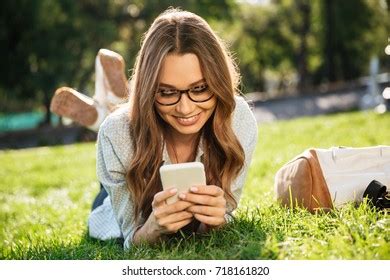 Happy Brunette Woman Eyeglasses Lying On Stock Photo 718161814