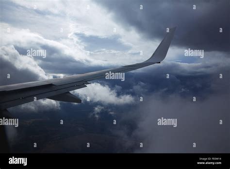 Aircraft Wing In A Cloudy Stormy Clouds Sky Flying Stock Photo Alamy