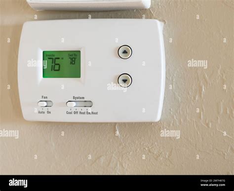 Programmable Digital Thermostat Set To Energy Saving 78 Degrees Wall