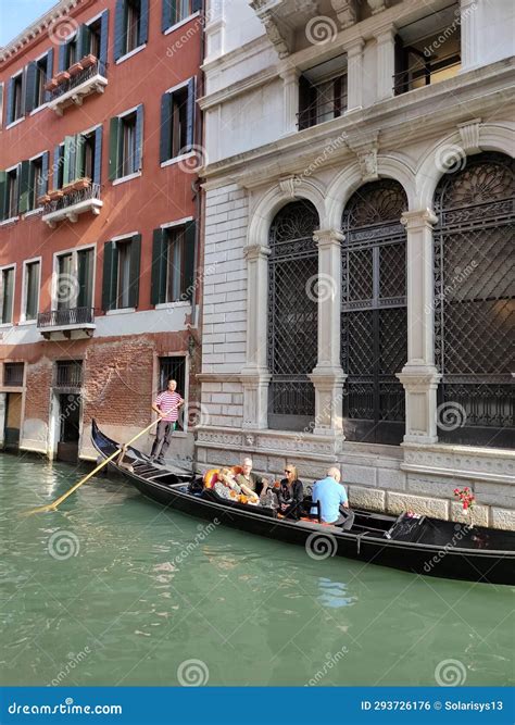 Venice, Italy - October 5, 2023: Tourists Floating in a Gondola in