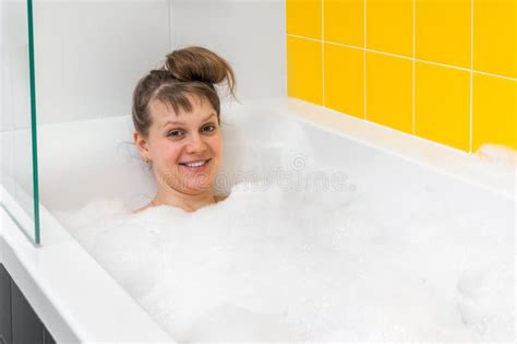 Beautiful Young Woman Is Taking Relaxing Bath With Foam Stock Image