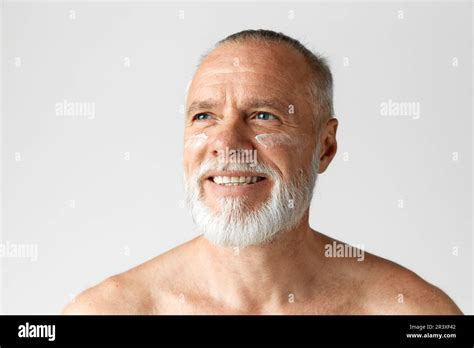 Portrait Of Handsome Mature Gray Haired Man Smiling Posing With Face