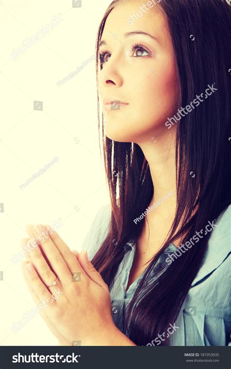 Closeup Portrait Of A Young Caucasian Woman Praying Isolated On White