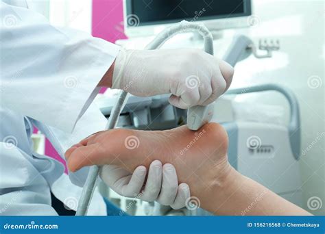 Doctor Conducting Ultrasound Of Patient`s Foot In Clinic Closeup Stock