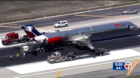 Red Air Plane Removed From Mia Runway As Ntsb Officials Continue Crash