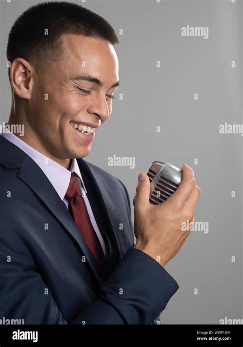 Singer with microphone Stock Photo - Alamy