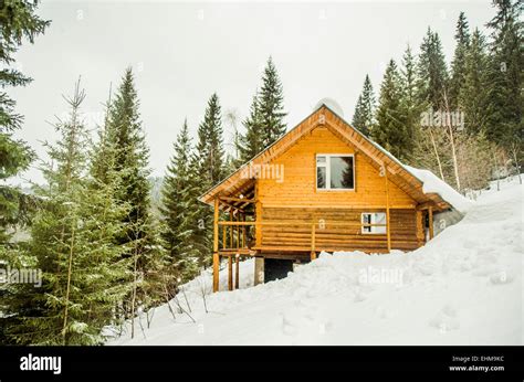 Cabin On Snowy Remote Hillside Stock Photo Alamy