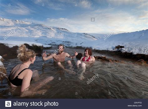 Friends Relaxing In Glacial Hot Spring Stock Photo Alamy