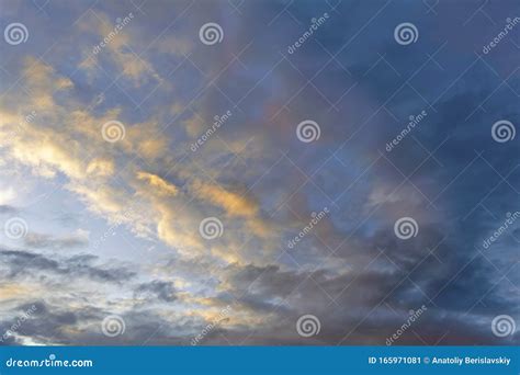 The Sky At Sunset Cumulus Clouds Lit By The Rays Of The Setting Sun