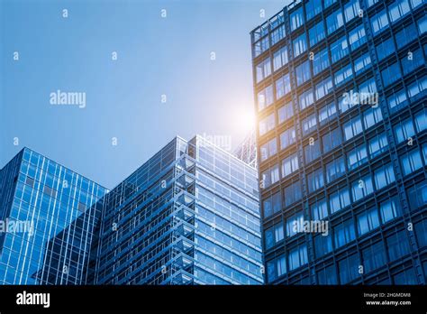 Modern Office Building With Glass Facade On A Clear Sky Background