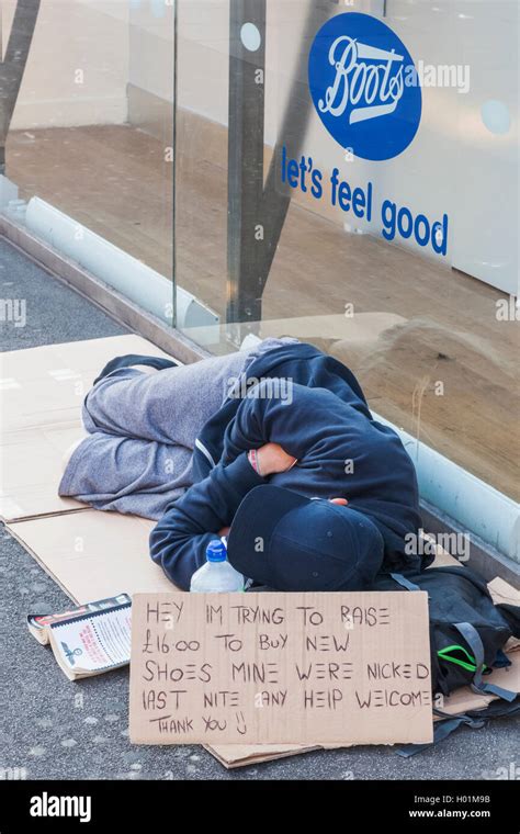 England London Oxford Street Homeless Man Sleeping On Sidewalk Stock