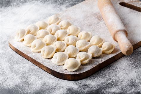 Homemade Raw Dumplings Pelmeni On Wooden Background Stock Photo