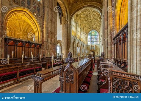 Choir Stalls In Church Interior With Rows Of Pews And Steps Leading Up