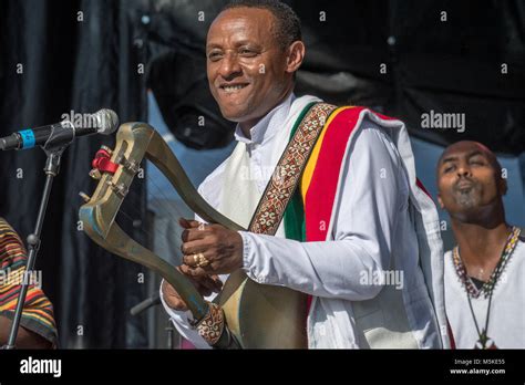 Member From The Feedel Band Strumming A Lyre At National Folk Life