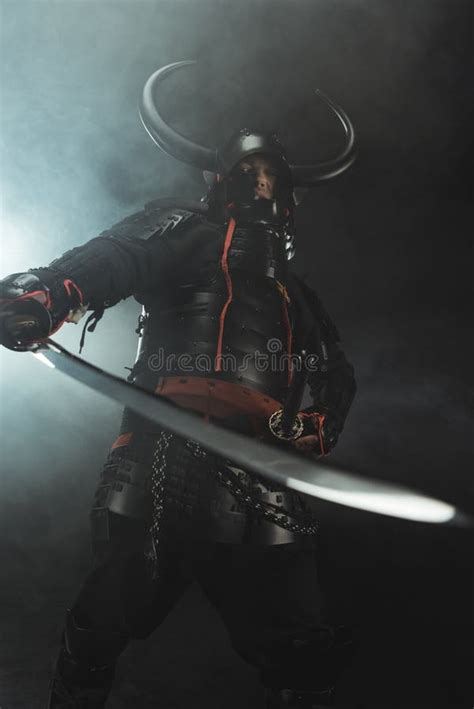 Bottom View Of Samurai In Traditional Armor With Sword On Dark