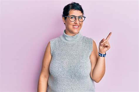 Plus Size Brunette Woman Wearing Casual Clothes And Glasses Smiling