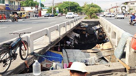 Families living under Quirino Bridge strive to survive