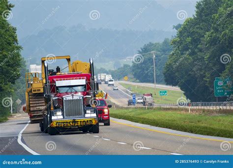 Oversize Load Of Heavy Machinery Being Transported By Semi Editorial