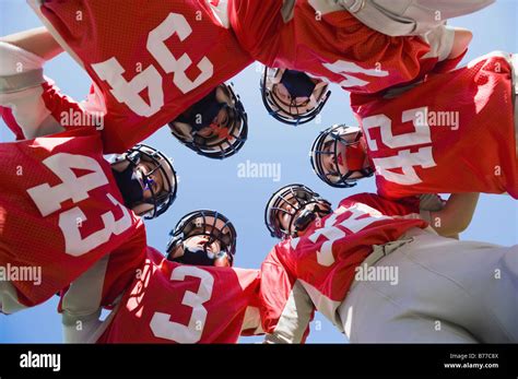 Football players huddle Stock Photo - Alamy