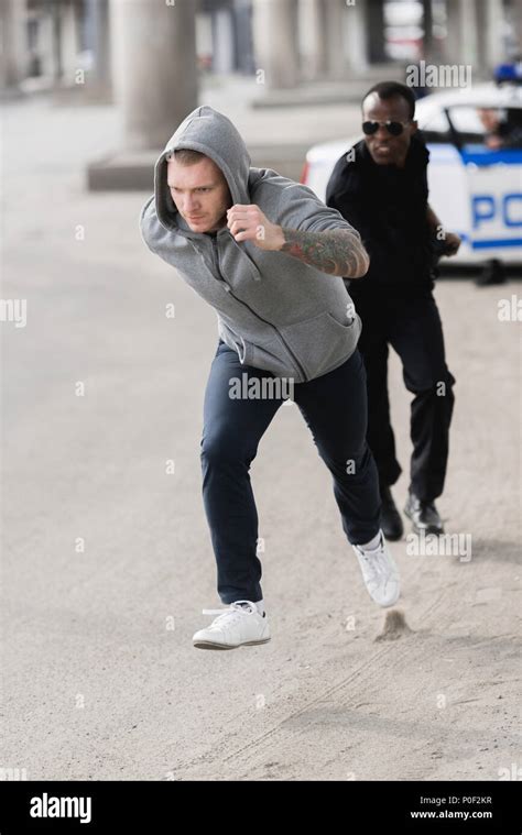 Male Police Officer Running Stock Photos And Male Police Officer Running