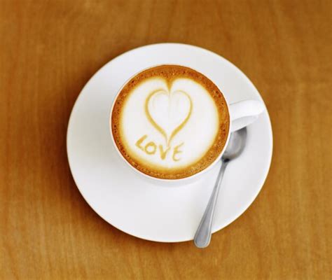 Premium Photo Coffee Cup Cappuccino And Heart In Foam On A Table With