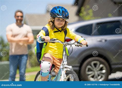 Fathers Day Father And Son Riding A Bike On The Road At The Fathers Day Concept Of Friendly