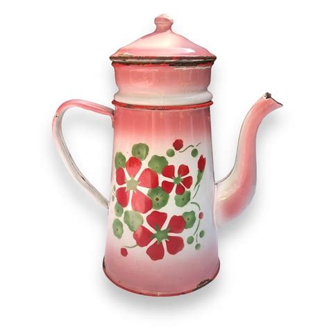 Ancienne cafetière en tôle émaillée rose et blanche décor floral