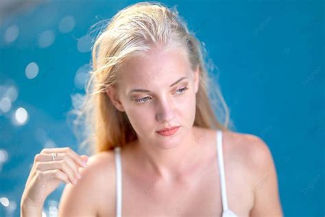 The Poolside Sunbathing Of A Lady In A White Bikini Photo Background And Picture For Free