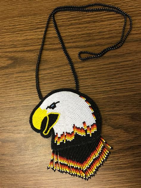 Beaded eagle medallion with fringe | Beading projects, Beading tutorials, Bead work