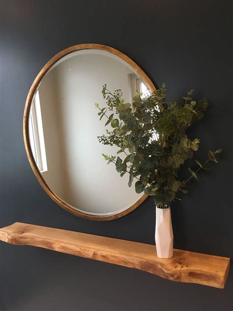 Bronze Round Mirror With Eucalyptus Leaves And A Floating Oak Shelf