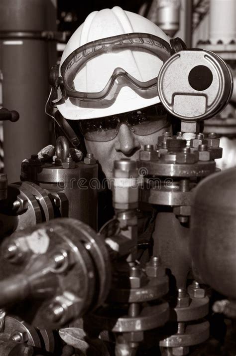 Engineer Oil Fuel And Gas Engineer Working Behind Pipeline Machinery