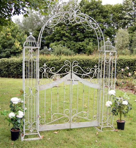 Buy the Antiqued Green Vintage Metal Garden Arch with Gates from Garden ...