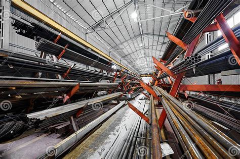 Aisle Between Racks With Rolled Metal Products In Store Stock Image