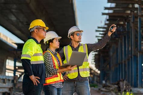 A Professional Team Of Engineers Architects Inspecting And Working