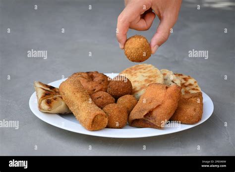 Authentic Sri Lankan different street food, short eats. Vegetable roti, coconut roti, cutlets ...