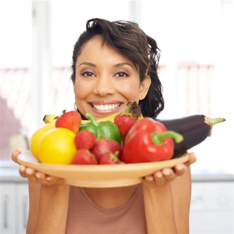 Health On A Plate Portrait Of A Young Woman Holding A Bowl Full Of